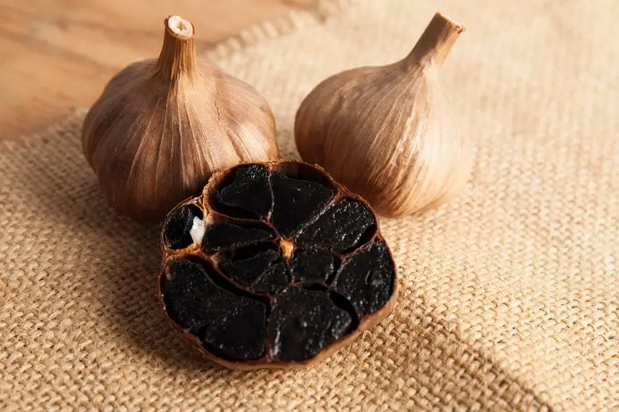 bigstock-black-garlic-close-up-206775781-min